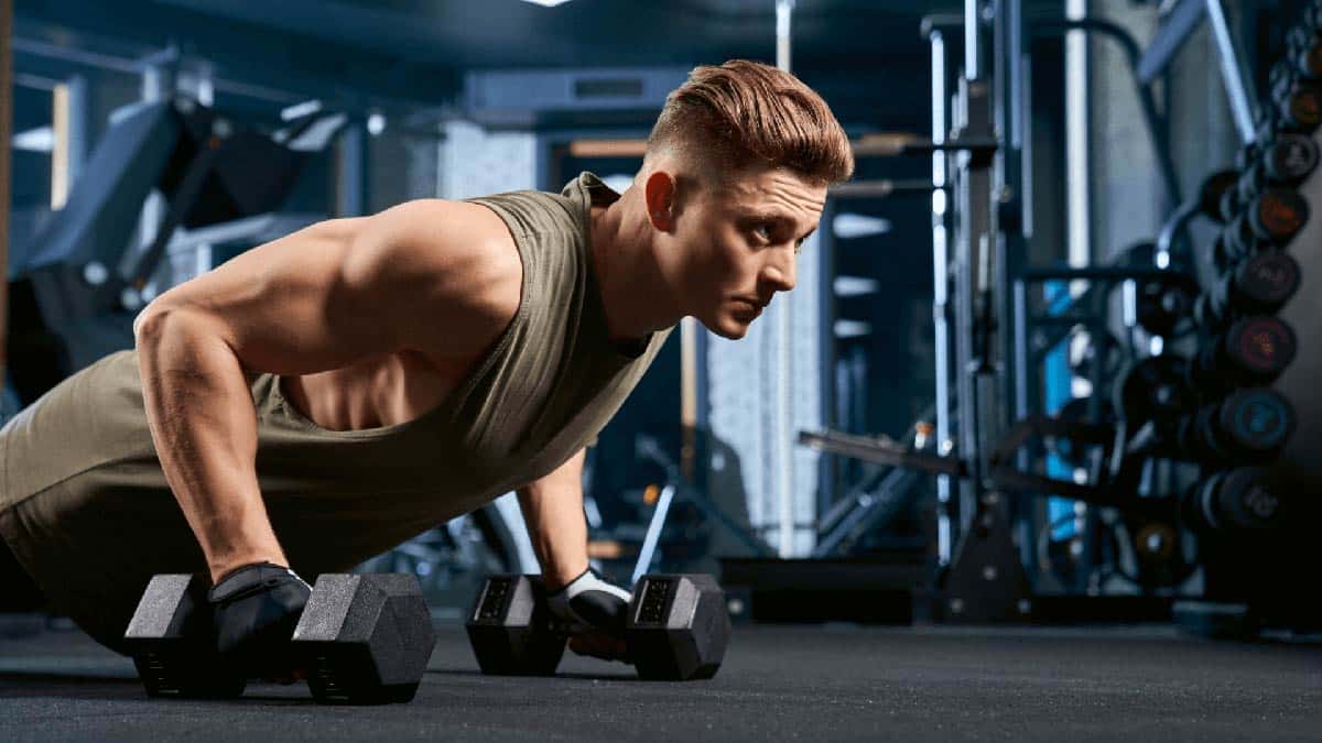 Man doing a push-up in a gym