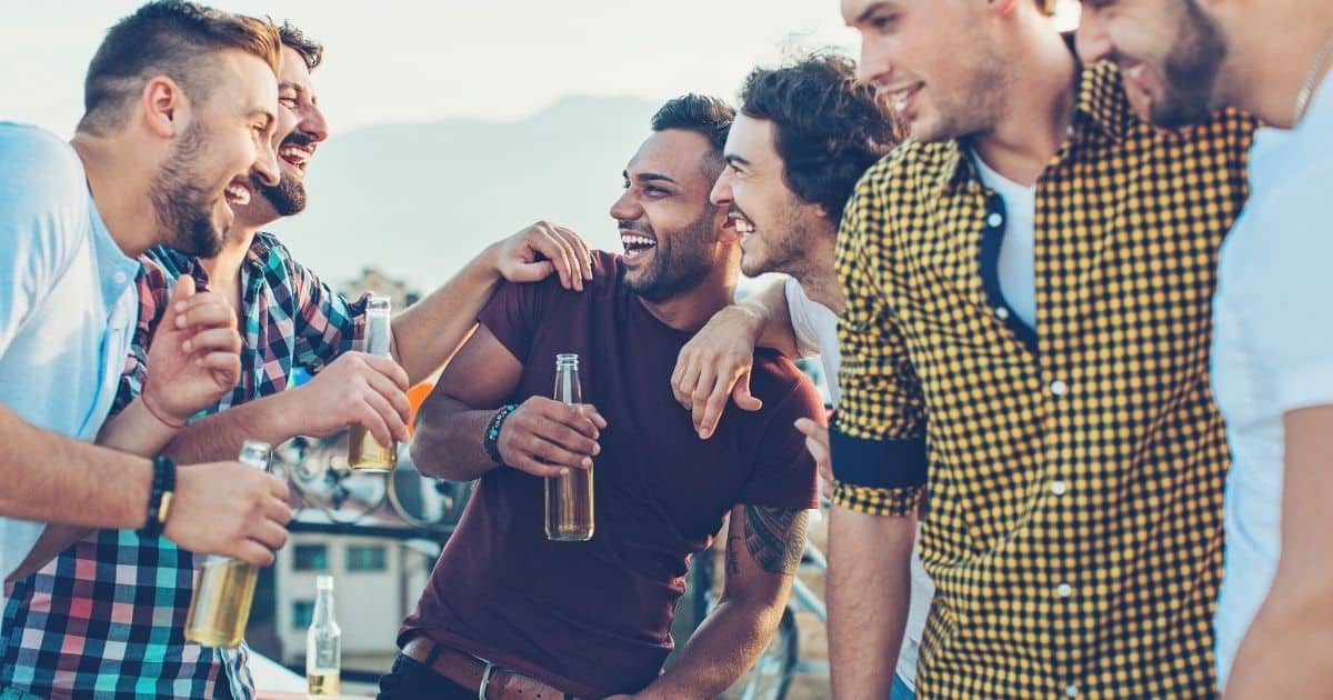 Group of men socializing with drinks