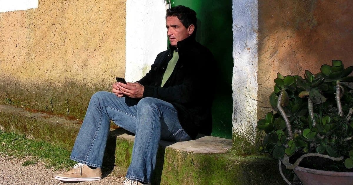 Man sitting on door step
