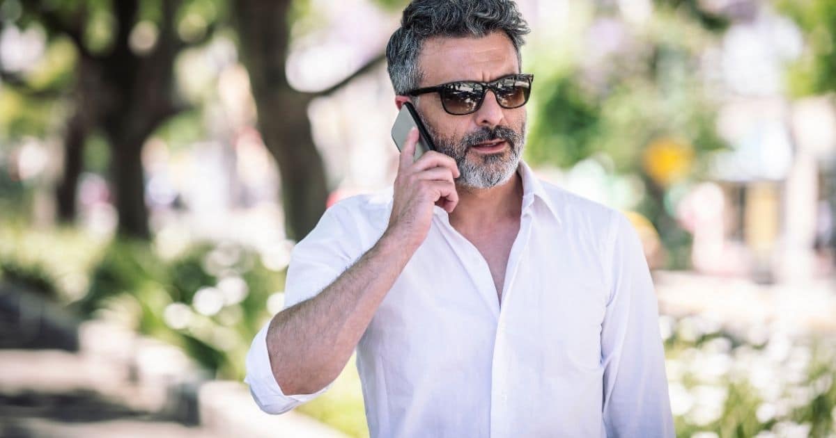 Man talking on a phone outdoors