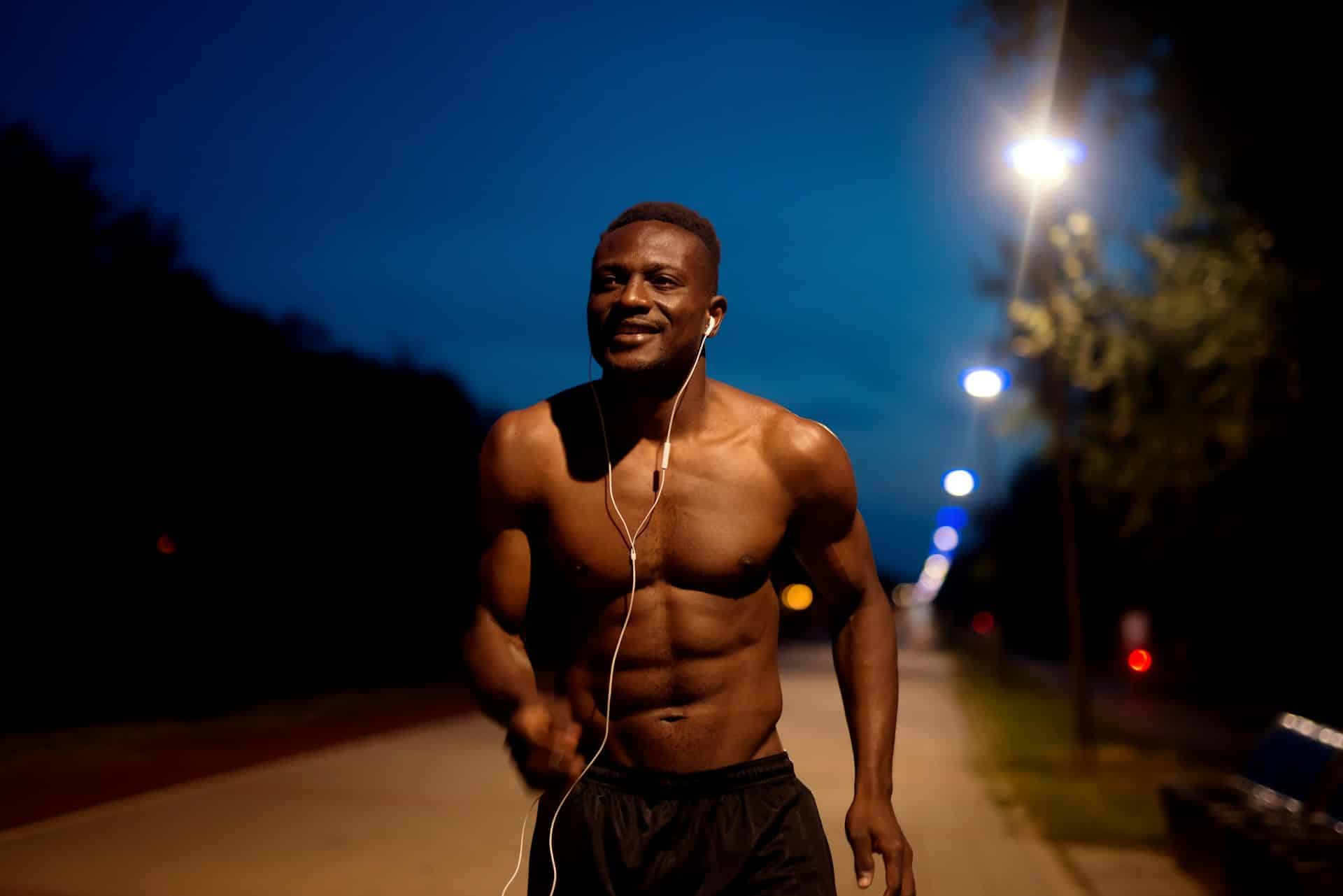 Man exercising at night showing athletic performance gains