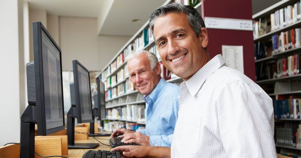 Men working together at computers