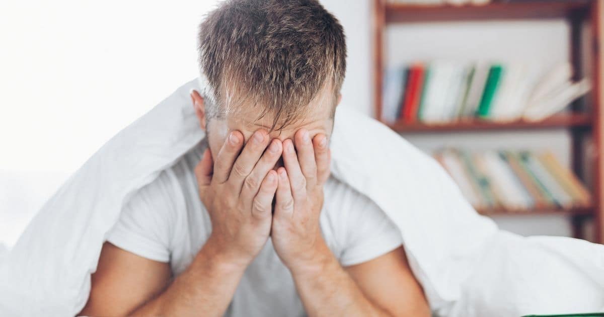Man with his head in his hands