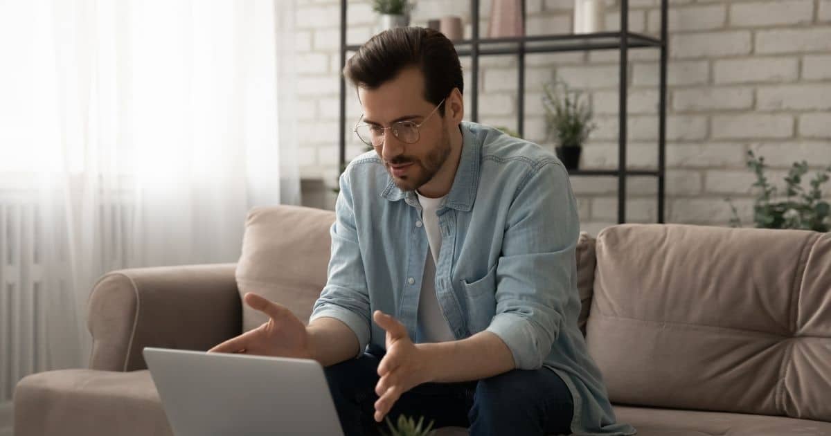 Man using a laptop on a couch