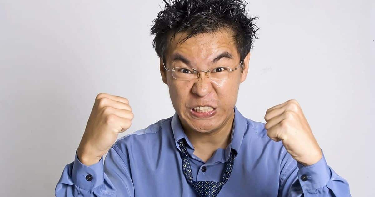 Angry man clenching his fists