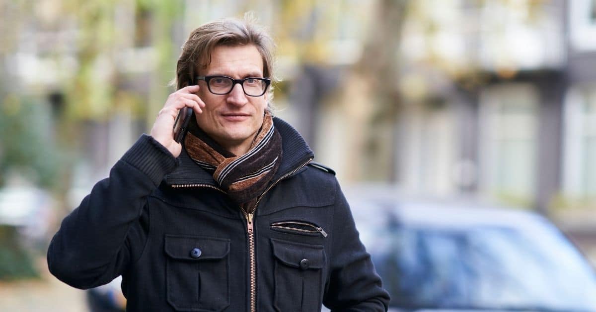 Man talking on a phone outdoors