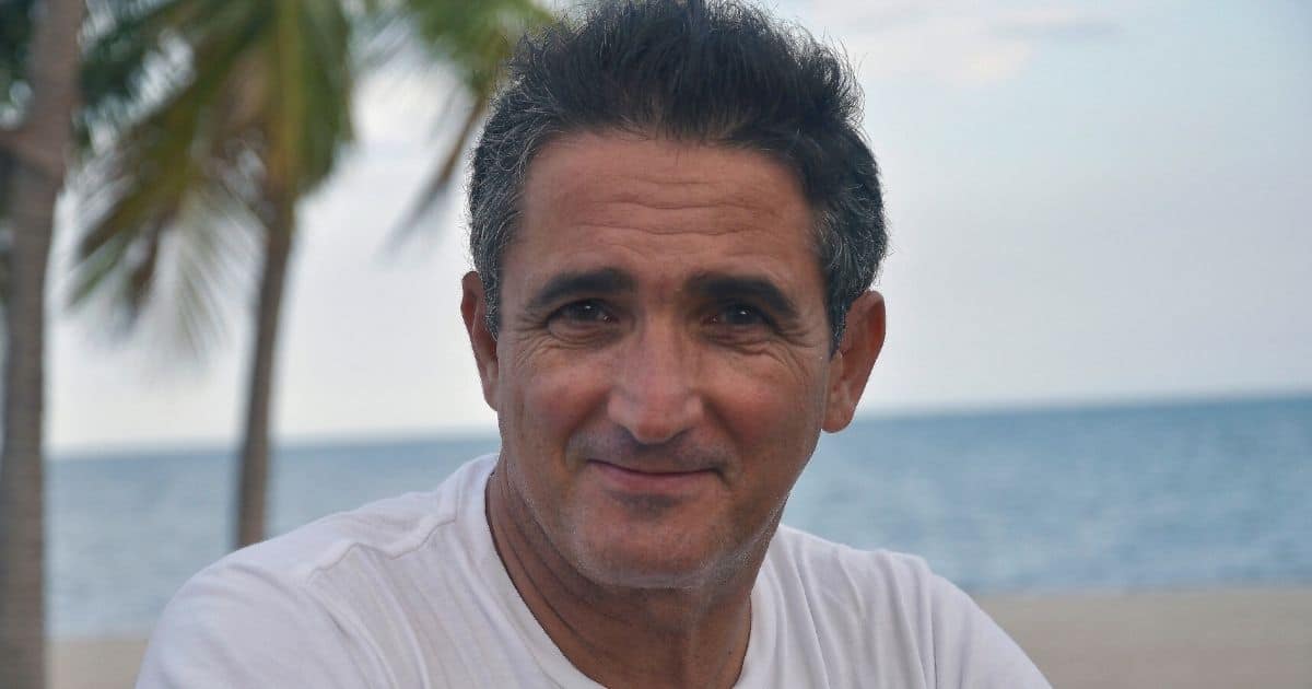 Older man standing near the ocean