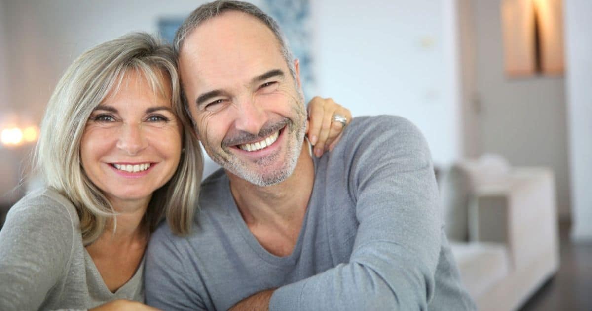 Smiling older couple sitting together