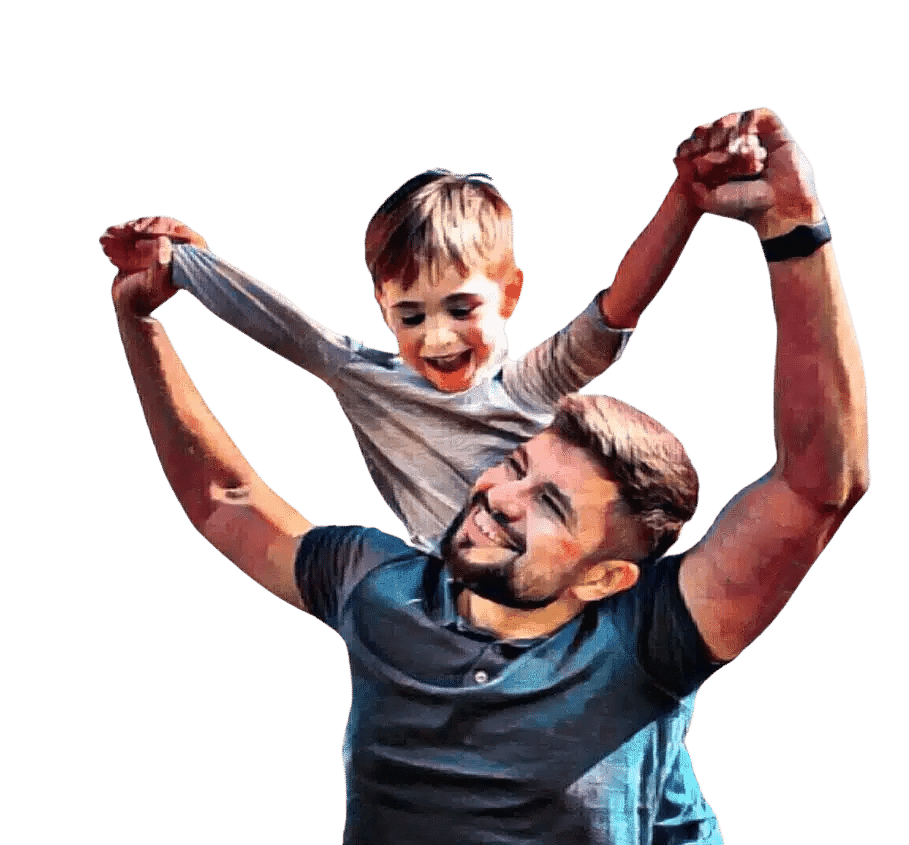 Father lifting his young son outdoors