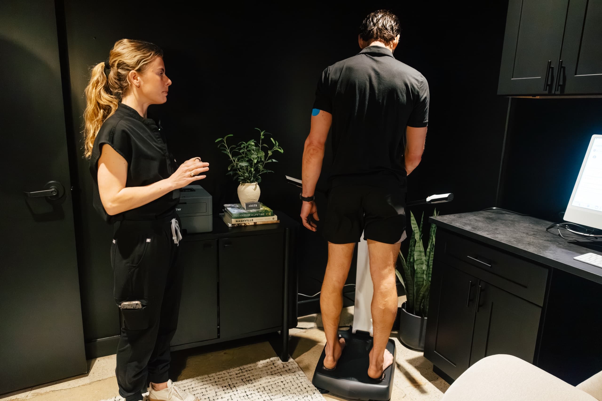 Patient stepping onto the InBody body composition scanner