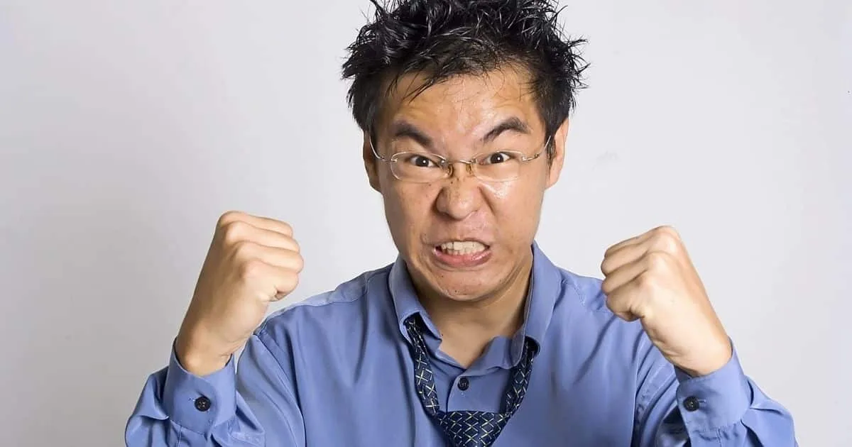 Angry man clenching his fists