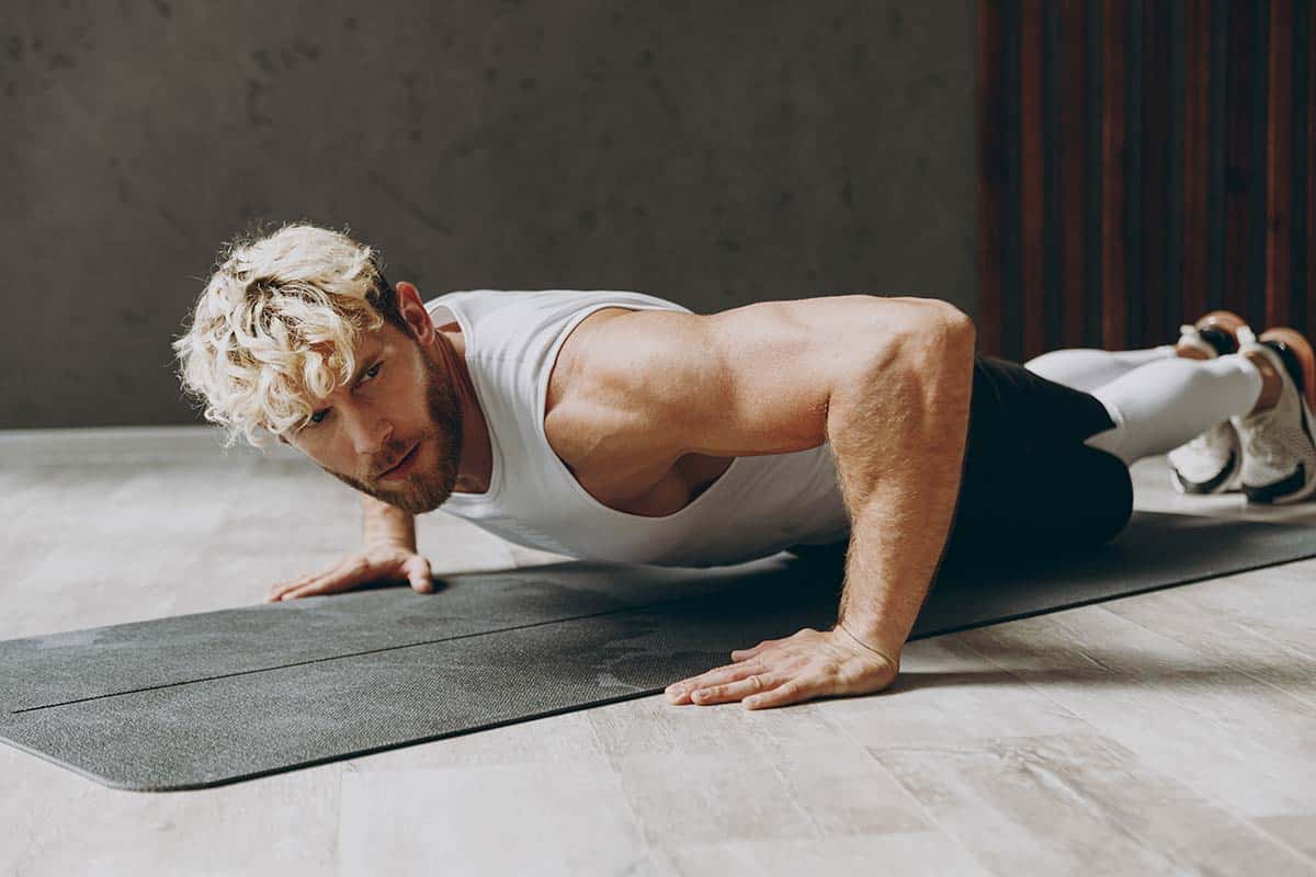 A man planking at the gym