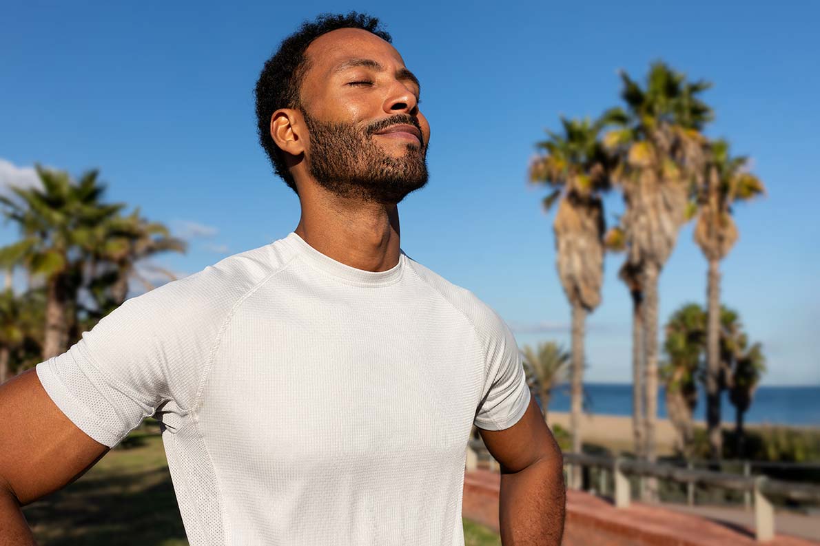 A man enjoying standing in the sun