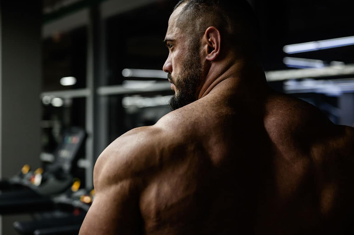 A muscular man in a gym