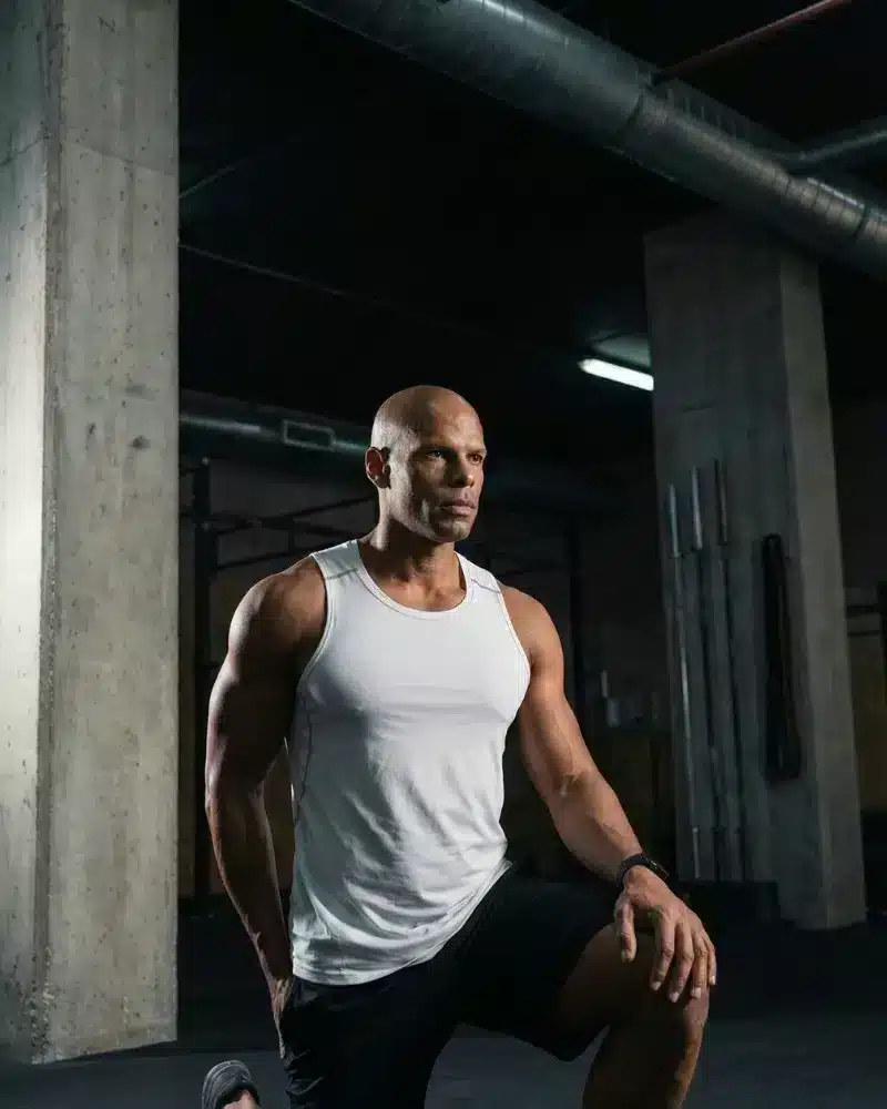 A man performing mobility exercises to increase his range of motion.